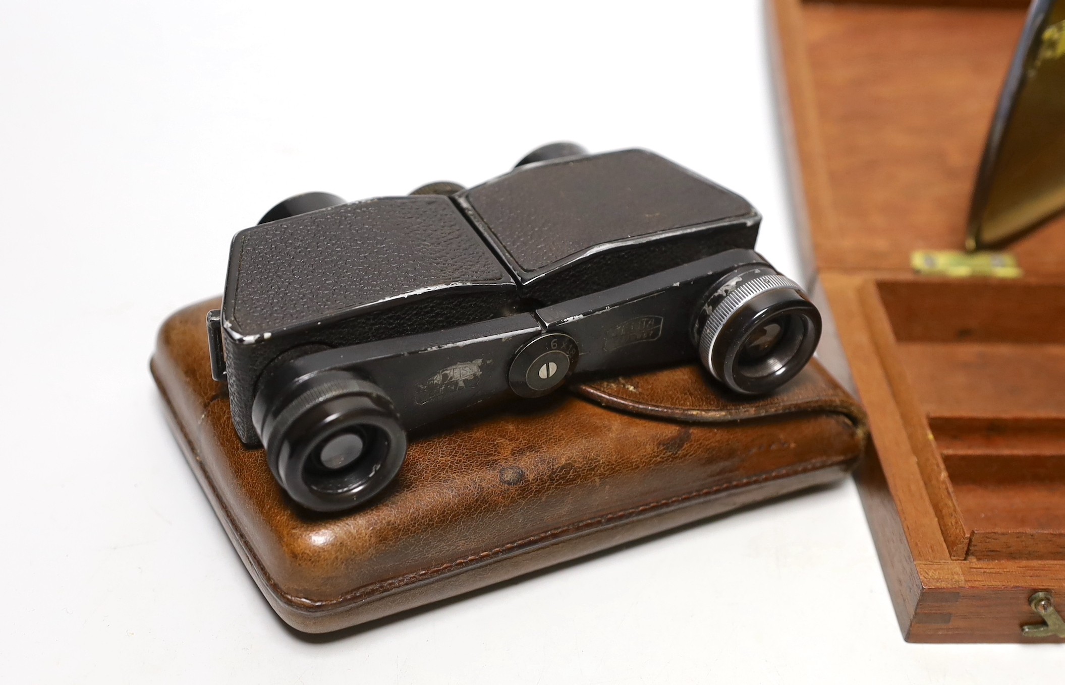 A pair of military binoculars, box of WWI and other medals, a silver card case and artist's box and pencil
